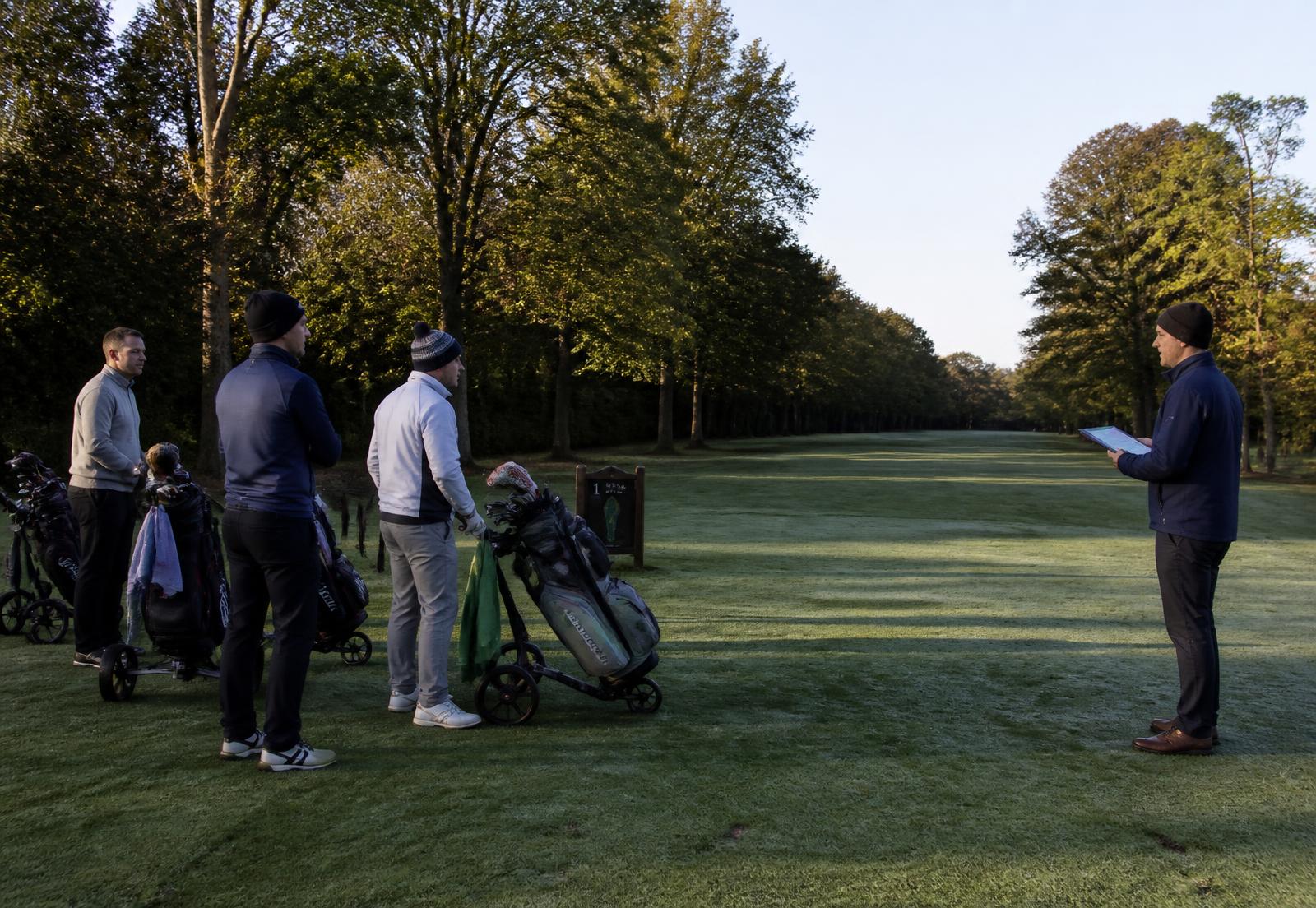 Golfers waiting on the first tee on a competition morning